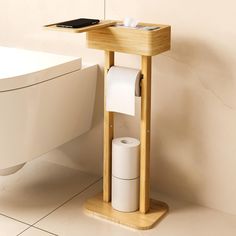 a wooden stand with two rolls of toilet paper on it