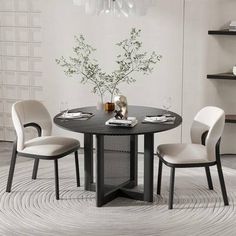 a round table with four chairs around it in a white and black dining room setting