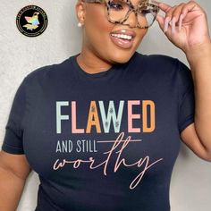 This 'Flawed and Still Worthy' t-shirt is a reminder that no matter what life throws at you, you are still capable of greatness. Show off your appreciation for yourself and others with this stylish and meaningful shirt. - FREE Shipping When You Spend $35! - Unisex T-shirt is 100% pre-shrunk cotton. - Shirt Available in Various Colors.  SIZING: - In order to get an accurate size, we recommend finding a similar item you already have, lay it flat, and measure it in inches. - Make sure to match those measurements to the Size Chart.  Care and Handling: - To ensure the longevity of your product we recommend washing this tee in cold water and drying on low heat or hang to dry.  - Do not bleach.  - Do not dry clean. - Do Not iron print. Important: - All items are MADE TO ORDER and have a fulfillme Trendy Tshirts Graphic Tees Design, Flawed And Still Worthy, Trendy T Shirt Designs, Christian Shirts Designs, Imperfectly Perfect, I Am Enough, Cute Shirt Designs, I Am Worthy, Tee Shirt Designs