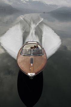 a speed boat is speeding across the water