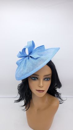 Elegant Blue sinamay Fascinator. Has clips for a secured and comfortable look.  This will be a great way to add elegance to any,  bridesmaid,  rehearsal dinner,  Wedding guest,  cocktail party, or church outfit. Also, comes in Hot Pink, blush, white, ivory and other colors - Ready to ship  - Free Shipping - Fast shipping - Customize by adding different color flowers and or feathers Check my store for for styles and colors.  Hatsandpearls.etsy.com Find more at my website: Www.hatsandpearls.com  Reach out to me if you can't find what you are looking for. I can make cake custom orders and help you style and match your outfit .  Send a picture of your dress and I will help you style it.  Thank you for visiting! Light Blue Adjustable Mini Hats For Kentucky Derby, Elegant Light Blue Fascinator For Kentucky Derby, Elegant Light Blue Spring Hat, Vintage Blue Hat For Kentucky Derby, Blue Wide-brim Fascinator For Kentucky Derby, Kentucky Derby Fascinator, Derby Fascinator, Easter Hats, Bridal Hat