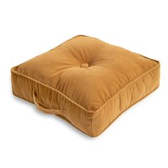 a brown square cushion on a white background