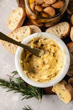 an assortment of breads and dip in a bowl