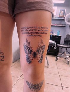 a woman's leg with a butterfly tattoo on it and a quote written in the middle