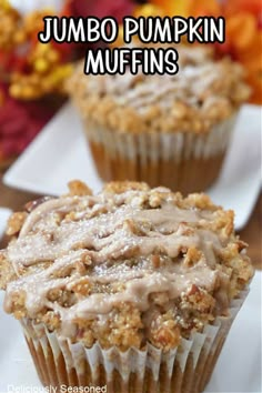 there is a muffin with icing on it and the words jumbo pumpkin muffins above it