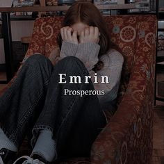 a woman sitting in a chair with her hands on her face and the words emrin prosperous