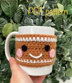 a hand holding a coffee cup with a crocheted face on it and text overlay that reads, pop pattern