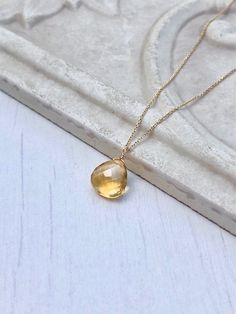 Yellow Topaz Necklace, November Birthstone, Yellow Topaz Teardrop Pendant, Solid 14k Gold, Real Gold Jewelry, Minimal Layering, Gift for her This beautiful dainty necklace features a flawless quality 8 mm micro faceted yellow topaz chubby teardrop wire wrapped in Solid 14k yellow gold. The yellow topaz pendant is suspended from a dainty solid 14k yellow gold chain. This is an everyday necklace, perfect for a gift for a girl born in November, as this is their birthstone. All element in this neckl Yellow Gold Briolette Gemstone Drop Necklace, Gold Drop Birthstone Necklace With Gemstone, Yellow Gold Drop Gemstones For Gift, Fine Jewelry Gold Drop Gemstones, Born In November, Jewelry Minimal, Topaz Birthstone, Real Gold Jewelry, Topaz Pendant