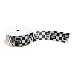 a black and white checkered ribbon with the words, the big six on it