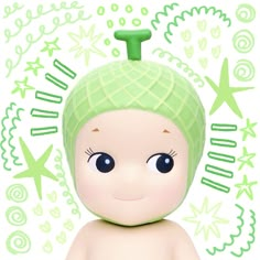 a baby doll with a green hat on it's head and stars in the background