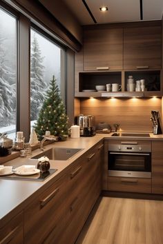 a kitchen with a christmas tree in the middle of it and lots of counter space