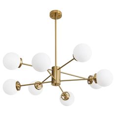 a brass chandelier with five white glass balls hanging from the middle of it