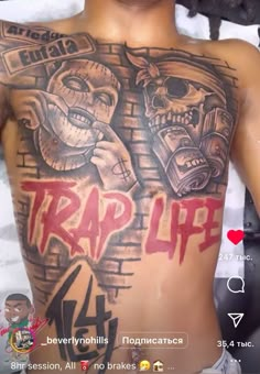 a man with a tattoo on his chest and arm that says trap life in red ink