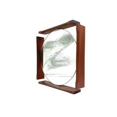 a wooden frame with a mirror on it