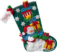 a christmas stocking with a snowman and presents hanging from it's side