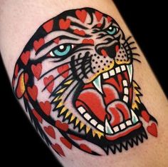 a tiger with hearts on his chest and mouth is shown in this tattoo design by the artist