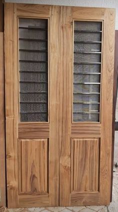 two wooden doors sitting next to each other