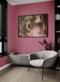 a living room with pink walls and white furniture in the corner, along with a painting on the wall