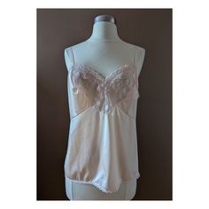 Vintage light pink camisole slip with lace detailing along the edge.  Size M. Message for more precise sizing details.  In perfect condition. Cheap Pink Camisole For Loungewear, Cheap Pink Camisole For Bedtime, Cheap Pink Spaghetti Strap Camisole, Cheap Pink Camisole, Fitted Pink Camisole With Delicate Lace, Coquette Camisole With Contrast Lace, Pink Lace Trim Camisole Top, Vintage White Camisole With Lace Trim, Pink Lace Trim Coquette Camisole