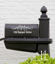 a black mailbox with the words 120 harper drive on it's front and side