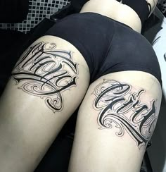 two women with tattoos on their legs and one has the word love written in cursive writing