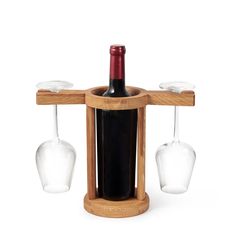 a wine bottle and two glasses on a wooden stand