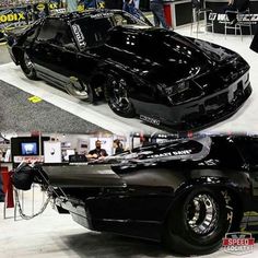 the black car is on display at an auto show