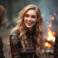 a woman with long blonde hair and leather outfit smiling at another woman in front of a fire