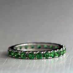 Emerald Eternity ring Green stone eternity ring | Etsy Classic Green Gemstone Eternity Band, Elegant Green Channel-set Rings, Classic Green Stackable Rings For Formal Occasions, Formal Green Stackable Rings, Green Gemstone Eternity Band Fine Jewelry, Green Gemstone Eternity Band For Promise, Fine Jewelry Green Emerald Cut Eternity Band, Elegant Green Eternity Band For May Birthstone, Elegant Green May Birthstone Eternity Band