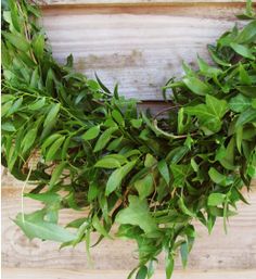 a close up of a wreath on a wooden surface