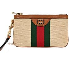 Crafted From Supreme Canvas And Calfskin Leather In Italy. This Accessory Features An Interlocking Gg Logo, Red And Green Web, And Removable Wristlet Strap. The Top Zip Closure Opens To Two Card Slots. Beige Vintage Gg Web Wristlet Pouch Green And Red Detailing Gold-Tone Hardware Supreme Canvas 100% Leather Trim Wristlet Style Pouch Top Zip Closure Interlocking Gg Logo Signature Web Removable Wristlet Strap 2 Card Slots 7" X 4" X 1" Product Number 576005 Made In Italy Gucci Marmont Matelasse Mini, Gucci Clutch Bag, Gucci Pouch, Gucci Vintage Bag, Gucci Clutch, Large Clutch, Vintage Suede, Canvas Pouch, Change Purse