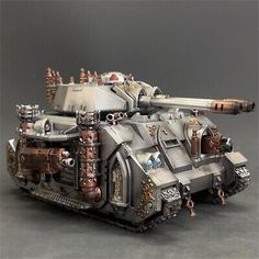 a toy tank with metal parts on it