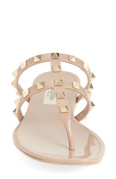 The Italian luxury fashion house's iconic Rockstuds make an appearance on this glossy jelly sandal designed to elevate your casual ensembles. Synthetic upper, lining and sole Made in Italy Designer Shoes Luxury Spiked Sandals For Summer, Designer Spiked Sandals For Summer, Designer Studded Sandals For Summer, Jelly Sandals, Designer Sandals, Italian Luxury, Sandal Women, Valentino Garavani, Designer Shoes