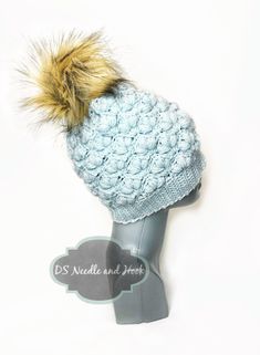 Light Blue Crochet Beanie with Faux Fur Pom, Blue Flower Knit Hat, Pastel Blue Winter Beanie, Baby Blue Knit Toque, Ski Cap *Fashionable crochet pom hat - one size fits most *Medium weight for wear both inside and outdoors *Other colors available in my shop - please ask if you don't see yours! *Handmade by me in a smoke free home *Ready to ship from Ohio This cute winter hat has been knit using soft acrylic and wool blend yarn. Please note that all photos have been taken in natural light in an e Fashionable Crochet, Light Blue Crochet, Knit Toque, Cute Winter Hats, Flower Knit, Yarn Gifts, Crocheted Items, Ski Cap, Blue Winter