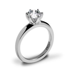 a white gold engagement ring with a single diamond