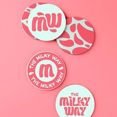 three stickers that say the milky way and the milky way on pink paper background