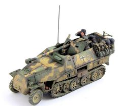 a toy army tank with two soldiers in it's turrets on a white background