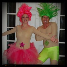 two people dressed in costumes posing for the camera