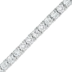 Elegant and affordable, this sparkling tennis-style bracelet is a great look any time. Fashioned in sleek sterling silver, this bracelet features a row of glistening 5.0mm lab-created white sapphires in durable four-prong settings. Buffed to a bright luster, this 7.5-inch bracelet secures with a lobster claw clasp. Sapphire Tennis Bracelet, Cheap Silver Rings, Mens Silver Necklace, Peoples Jewellers, Silver Jewellery Sets, Cute Bracelets, Strand Bracelet, Sapphire Jewelry, Stylish Jewelry