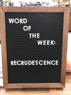 a sign that says word of the week recrudescence on it's side