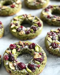 some cookies with nuts and cranberries on them