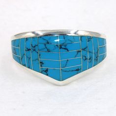 "Large beautiful blue faux turquoise sterling silver hinged cuff bracelet.  Marked 925.  Certain to be a treasure in your personal jewelry collection. FREE SHIPPING! Details:  Sterling Silver: (as shown in picture) Faux Turquoise: inlay Approximate Dimensions: 1 1/2 inch wide at top, inside circumference is 6 3/4 inches Wrist Size: 6 - 6 1/2 inches  Total Weight: 78.0 grams FREE domestic shipping by USPS Priority Mail delivery confirmation and includes insurance. If the item is to be shipped internationally Etsy will calculate postage. Please notify us at purchase if you are buying more than one item and we will gladly combine shipping. 7 day \"no hassle\" return policy money back guarantee. If for any reason you are not 100% thrilled with your purchase, please contact us and we will gladl Adjustable Blue Cuff Bracelet For Anniversary, Unique Blue Turquoise Ring With Inlay, Blue Sterling Silver Cuff Bracelet With Gemstone, Southwestern Blue Cuff Bracelet As Gift, Blue Inlay Bracelet Jewelry, Southwestern Style Blue Inlay Bracelets, Blue Inlay Bracelet, Southwestern Style Nickel Free Blue Cuff Bracelet, Southwestern Blue Nickel-free Cuff Bracelet