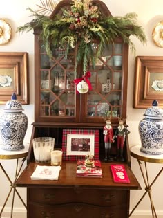 an old china cabinet is decorated with christmas decorations