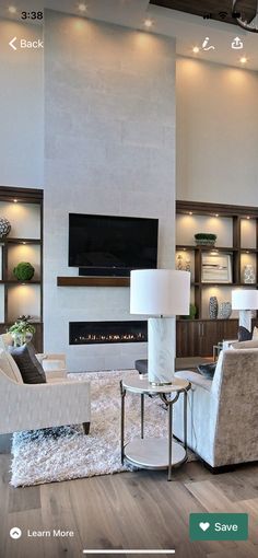 a living room filled with furniture and a flat screen tv mounted to the wall over a fireplace