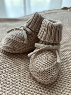 Cotton knit baby booties.  Available in 9cm approx (suitable for 0 to 6mths) and 11cm approx (suitable for 6 to 12mths). A great new baby gift, birth announcement or baby shower gift. Booties are soft and cosy for little feet! Pair with our blankets or comforters for the most perfect baby gift idea! Booties are made from 100% cotton. Cozy Cream Winter Booties, Cute Soft Sole Booties As Gift, Cute Hand Knitted Round Toe Booties, Cute Knitted Round Toe Booties, Cute Knitted Booties As Gift, Cute Hand Knitted Winter Booties, White Booties As Winter Gift, White Winter Booties As A Gift, White Winter Booties As Gift