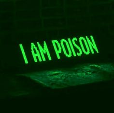 the words i am poison glow green in the dark