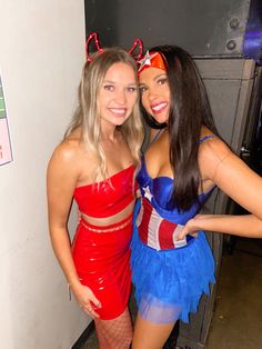 two women in costumes posing for the camera