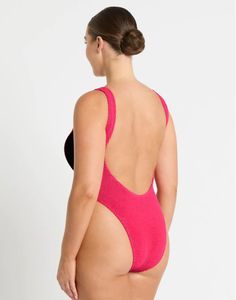 Designed for the daring beachgoer, this sporty surf-style marvel features a versatile center zip that effortlessly transitions between an open, alluring look and a secure, closed fit. 88% Recycled Nylon, 7% Nylon, 5% Lycra Half Center Zipper, Can Be Worn Open or Closed Branded Zipper That Locks in Place Soft V-Neck Line Low Scoop Back Wide Shoulder Straps for Support Ideal For Any Bust Size Can Be Worn Low, Mid or High On Hip Hand Wash Cold Separately Sporty Nylon Swimwear For Poolside, Sporty Stretch Swimwear In Polyamide, Sporty Polyamide Swimwear For Swimming, Pink Athletic Swimwear In Nylon, Pink Nylon Athleisure Swimwear, Sporty Lined Swimwear For Beach Season, Sporty Nylon Swimwear For Sunbathing, Nylon Athleisure Swimwear For Beach Season, Nylon Athleisure Swimwear