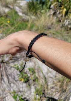 Get the Black Braided Volleyball Bracelet here! The color black signifies strength and power. Give the wish of volleyball strength! Gold 2 sided charm with a volleyball on one side and the iconic VidaVibe V on the other. This inspiring bracelet is a reminder of inner strength and can be worn as a symbol of power and protection, whether on the court or off. Show your support for your favorite volleyball team or athlete with a meaningful and fashionable accessory! Included in 3 Bracelets for $15, Spiritual Black Braided Bracelets For Friendship, Black Resizable Spiritual Braided Bracelet, Black Spiritual Braided Adjustable Bracelets, Spiritual Black Resizable Braided Bracelets, Black Spiritual Braided Bracelet, Adjustable Black Hypoallergenic Bracelets, Adjustable Hypoallergenic Black Wristband, Adjustable Hypoallergenic Black Bracelets, Adjustable Hypoallergenic Black Bracelet