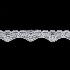 a white lace on a black background